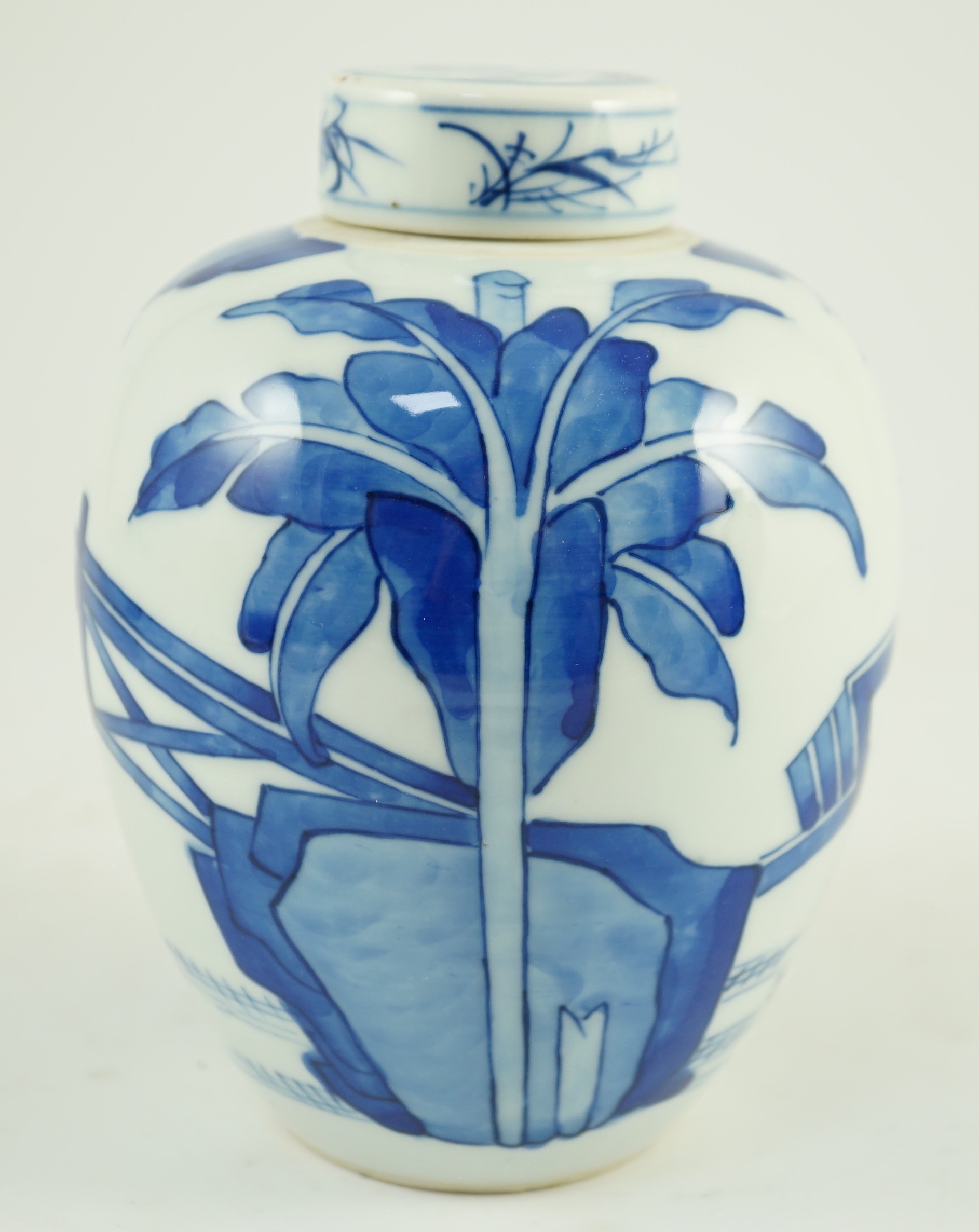 A Chinese blue and white jar and cover, probably Kangxi period, 15 cms high, 14.8cm high, small glaze losses to cover